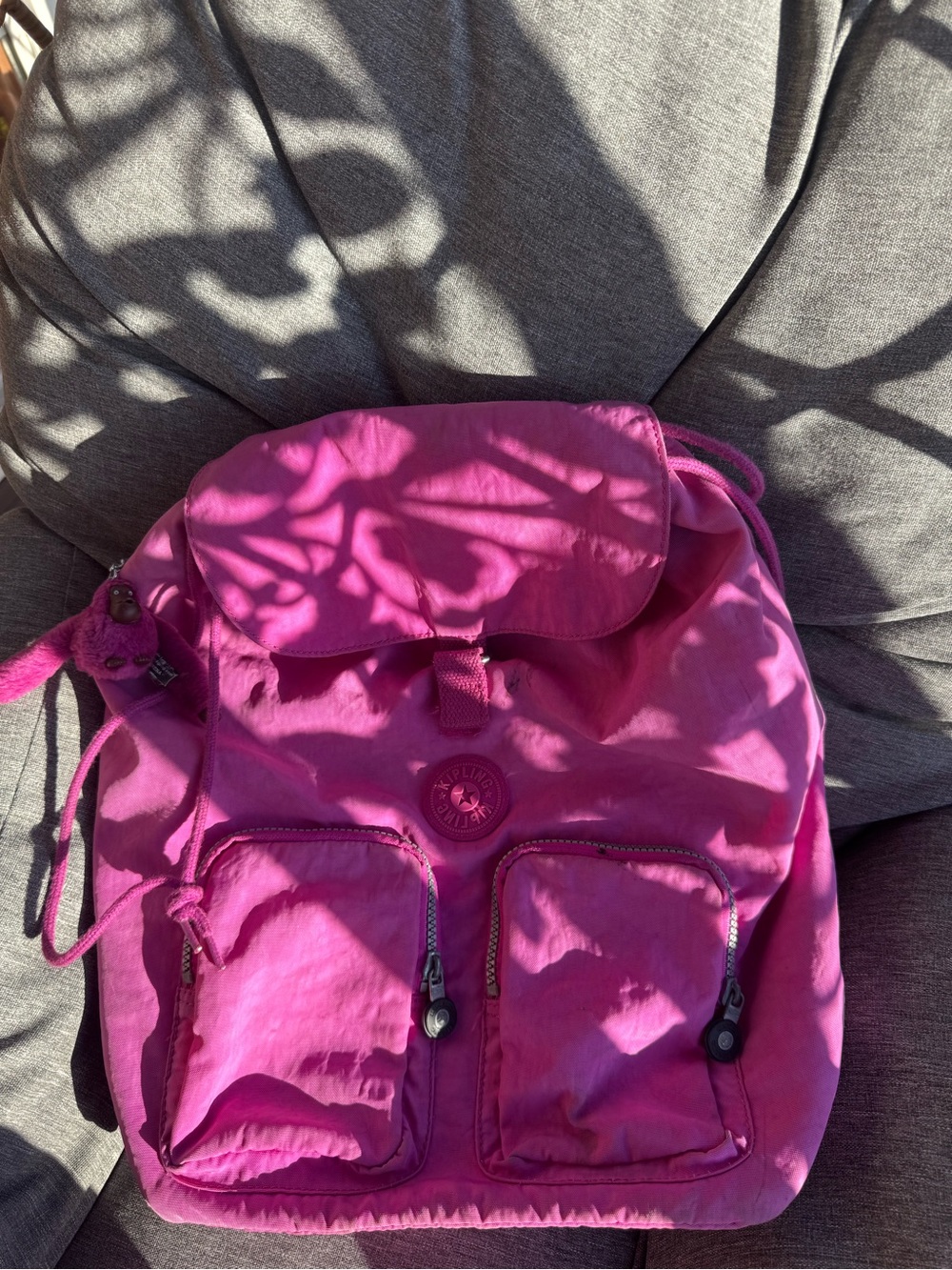 Kipling Bright Pink Nylon Backpack with iconic monkey keychain